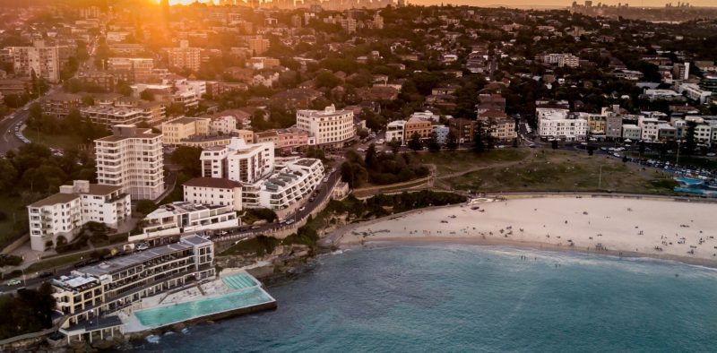 Beautiful aerial shot of a coastal city and the sea at dawn
